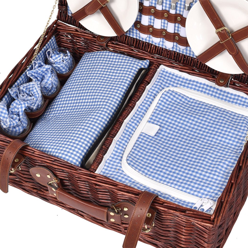 A stylish 4-person picnic basket set made of willow, featuring PU leather straps, an insulated bag, and a matching blanket, perfect for outdoor dining.