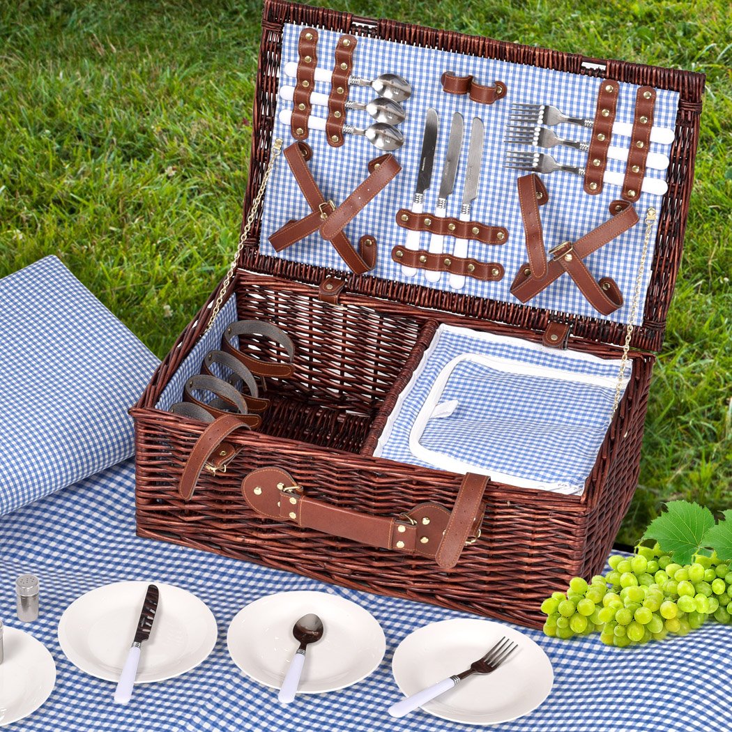 A stylish 4-person picnic basket set made of willow, featuring PU leather straps, an insulated bag, and a matching blanket, perfect for outdoor dining.