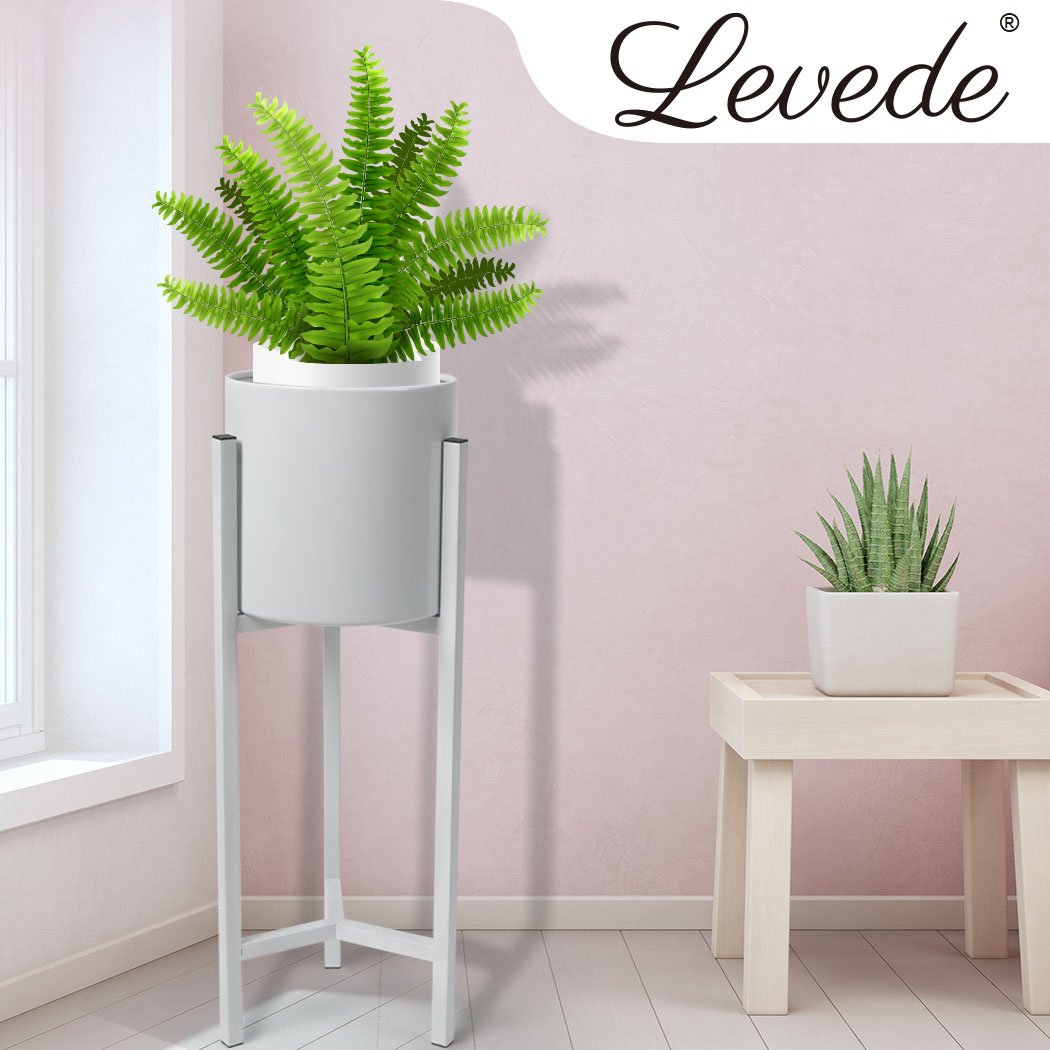 Stylish metal plant stand with a white finish, showcasing a beautiful flower pot, designed for indoor and outdoor use.