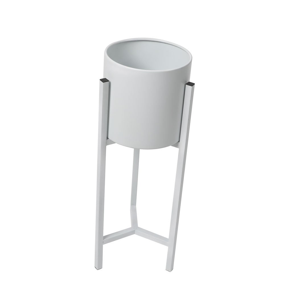 Elegant metal plant stand with a detachable pot, perfect for showcasing plants indoors and outdoors.