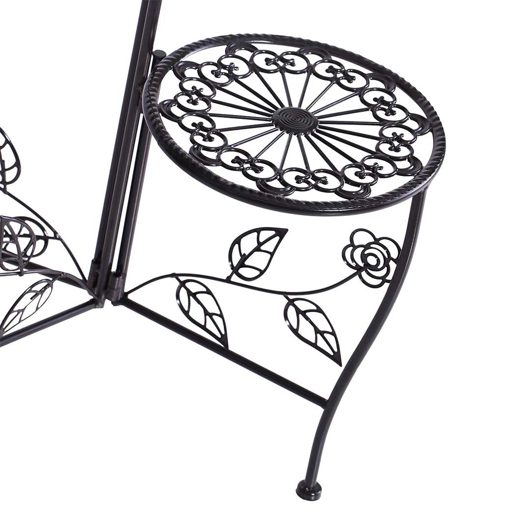 A stylish black metal plant stand with multiple tiers, showcasing various flower pots and greenery, suitable for indoor and outdoor use.