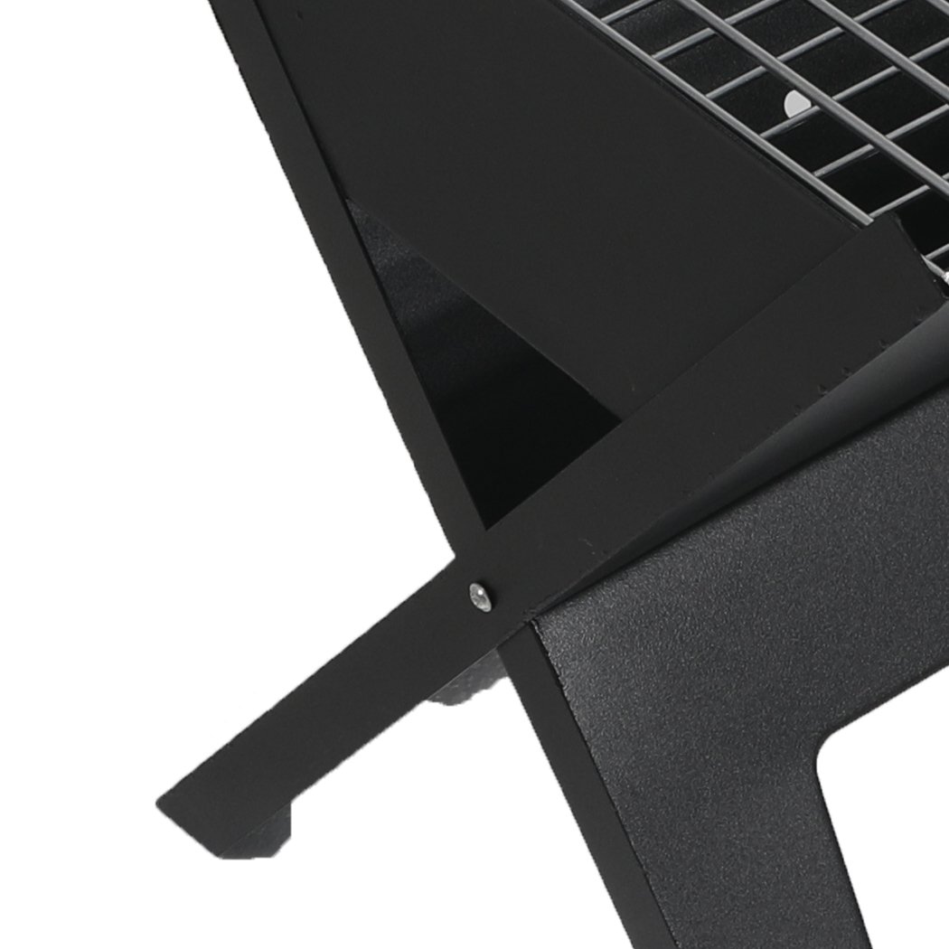 Portable BBQ Charcoal Grill with foldable design, ideal for outdoor cooking and camping.