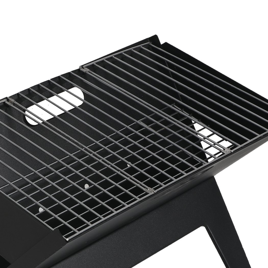 Portable BBQ Charcoal Grill with foldable design, ideal for outdoor cooking and camping.