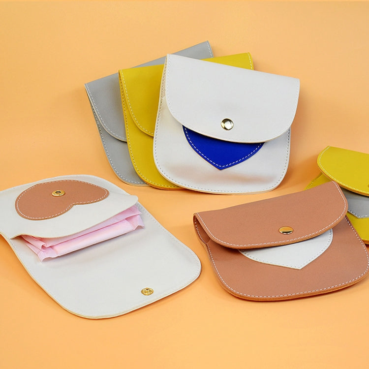 Portable Large Capacity PU Sanitary Napkin Pad Storage Bag in skin and white color, showcasing its sleek design and practical features.
