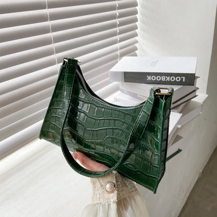 Green faux crocodile handbag.