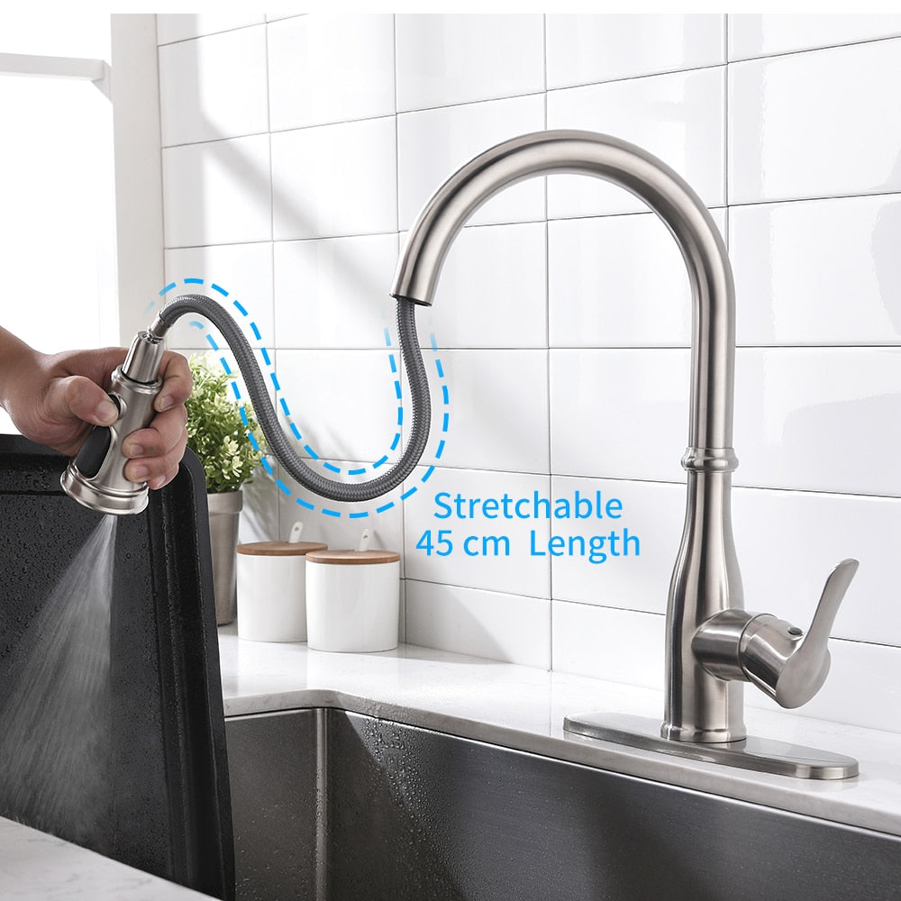 Stretchable kitchen faucet being adjusted.