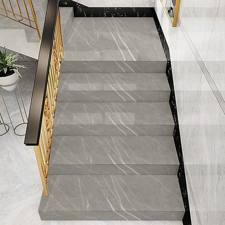 PVC Imitation Marble Stair Step Anti-Slip Sticker showcasing its twill pattern and self-adhesive backing, ideal for enhancing stair safety.