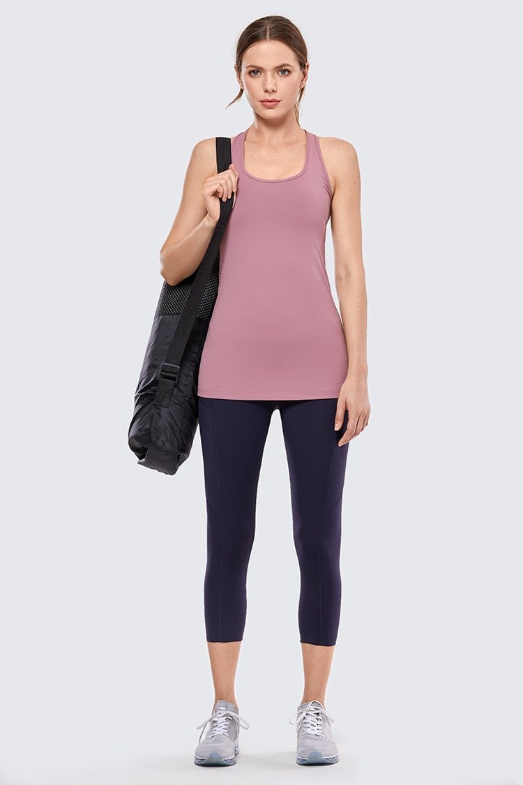 A stylish collection of Racerback Workout Tank Tops for Women in various colors including black, white, pink, and blue violet, showcasing their sleeveless design.