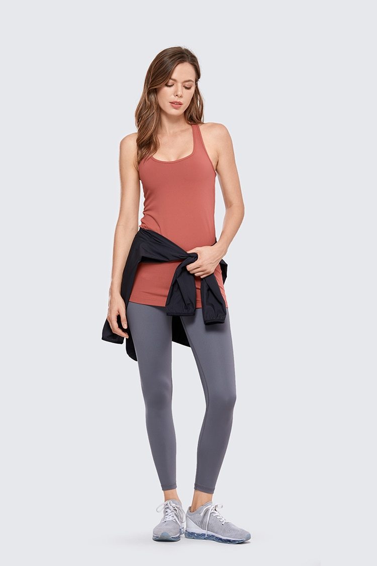 A stylish collection of Racerback Workout Tank Tops for Women in various colors including black, white, pink, and blue violet, showcasing their sleeveless design.