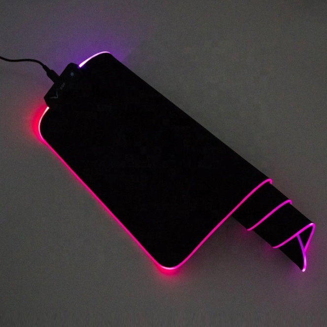 RBG Lightning Mode Extra Large Gaming Mousepad with vibrant RGB lighting and 14 modes, showcasing its sleek design and spacious surface.