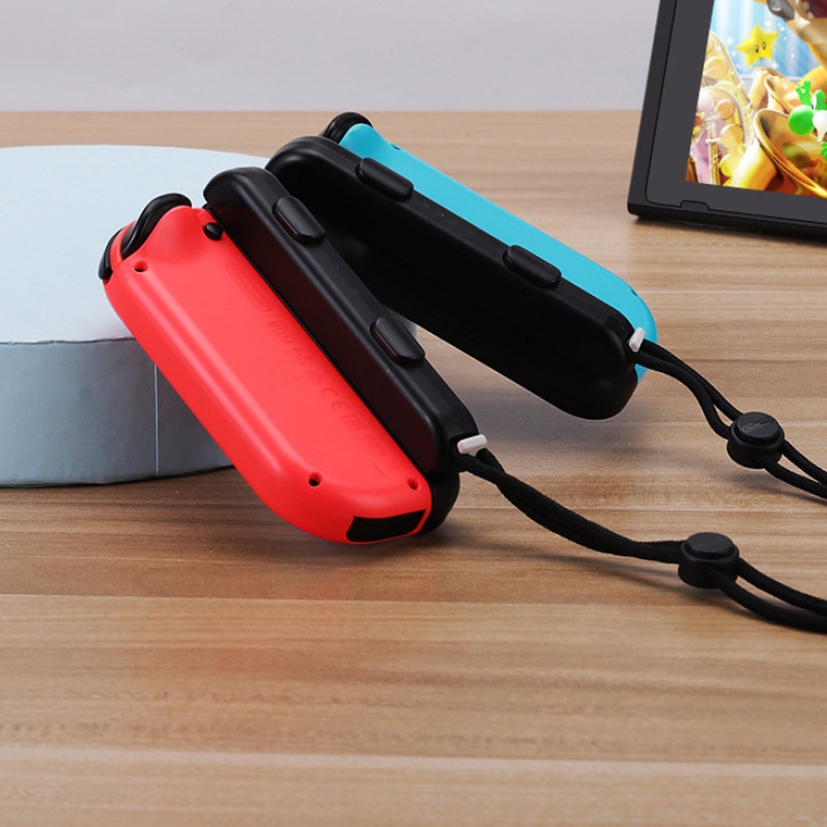 Red and blue Switch game controller with ergonomic design and rubberized grip for comfortable gaming.