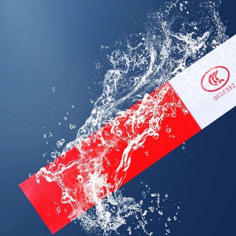 Reflective trailer safety tape in red and white, designed for high visibility on vehicles and trailers.