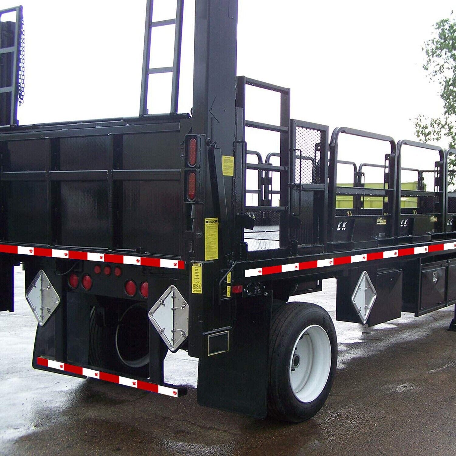Reflective trailer safety tape in red and white, designed for high visibility on vehicles and trailers.