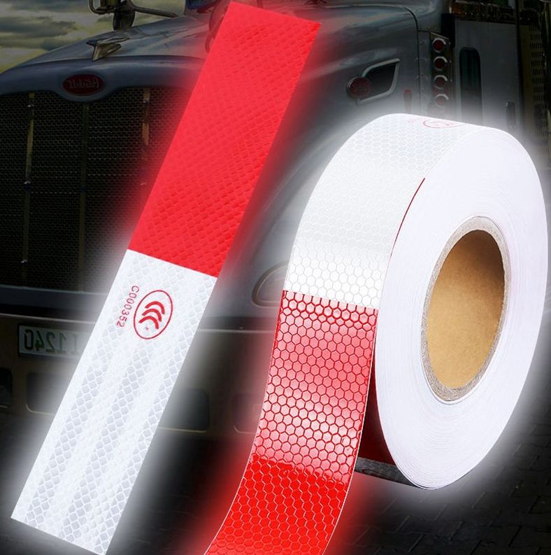Reflective trailer safety tape in red and white, designed for high visibility on vehicles and trailers.