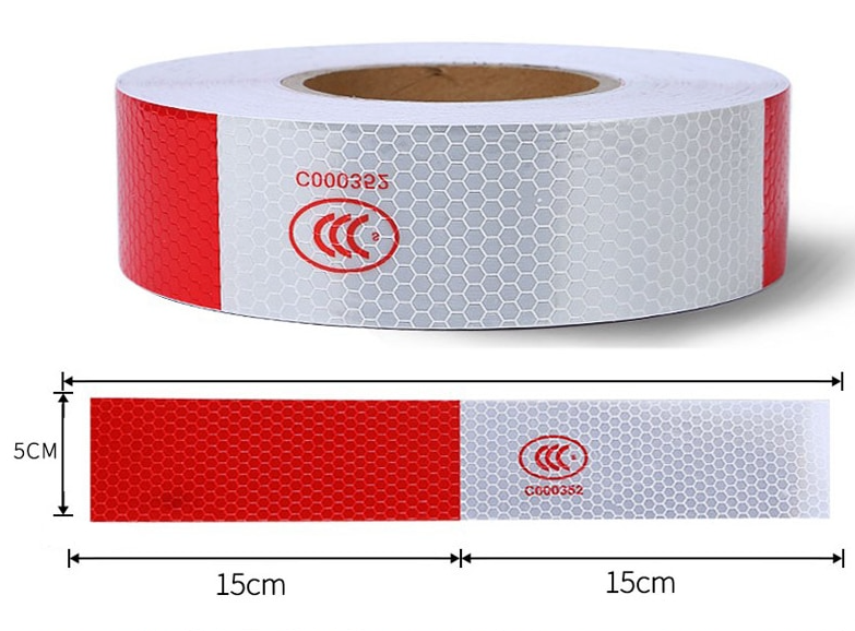 Reflective trailer safety tape in red and white, designed for high visibility on vehicles and trailers.