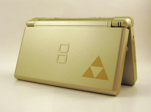 Replacement housing shell for Nintendo DS Lite in Gold Zelda Triforce design, showcasing a glass lens and high-quality finish.