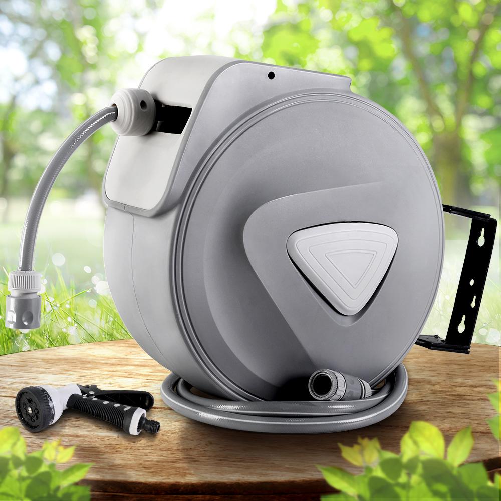 Retractable Hose Reel 30M with spray gun, showcasing a sleek grey design and wall-mounted feature for easy garden watering.