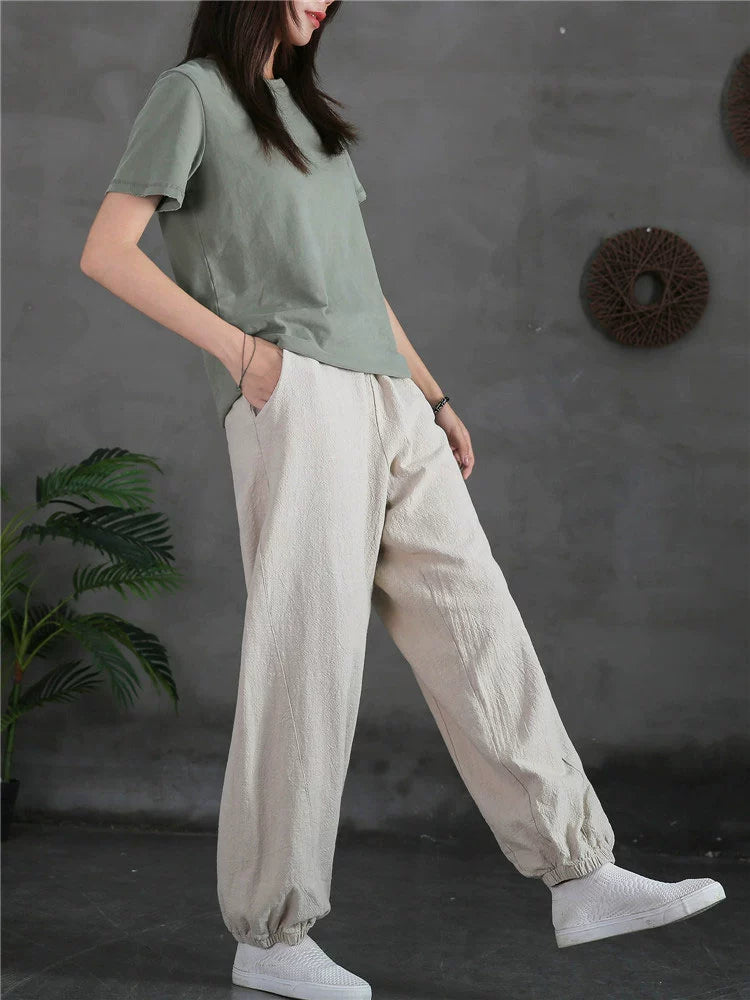 A pair of stylish high waist yoga pants made from soft linen, featuring a retro design suitable for autumn and winter wear.