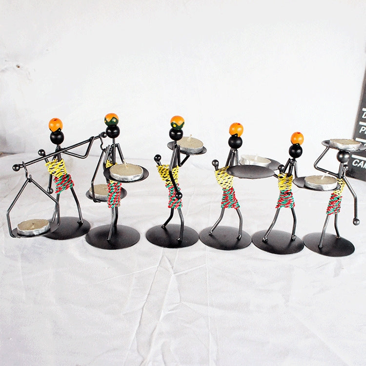 Retro Wrought Iron Man-shaped Candlestick Ornament, showcasing a unique design perfect for home and restaurant decor.