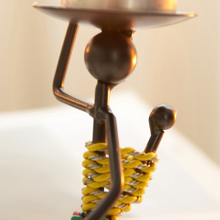 Retro Wrought Iron Man-shaped Candlestick Ornament, showcasing a unique design perfect for home and restaurant decor.