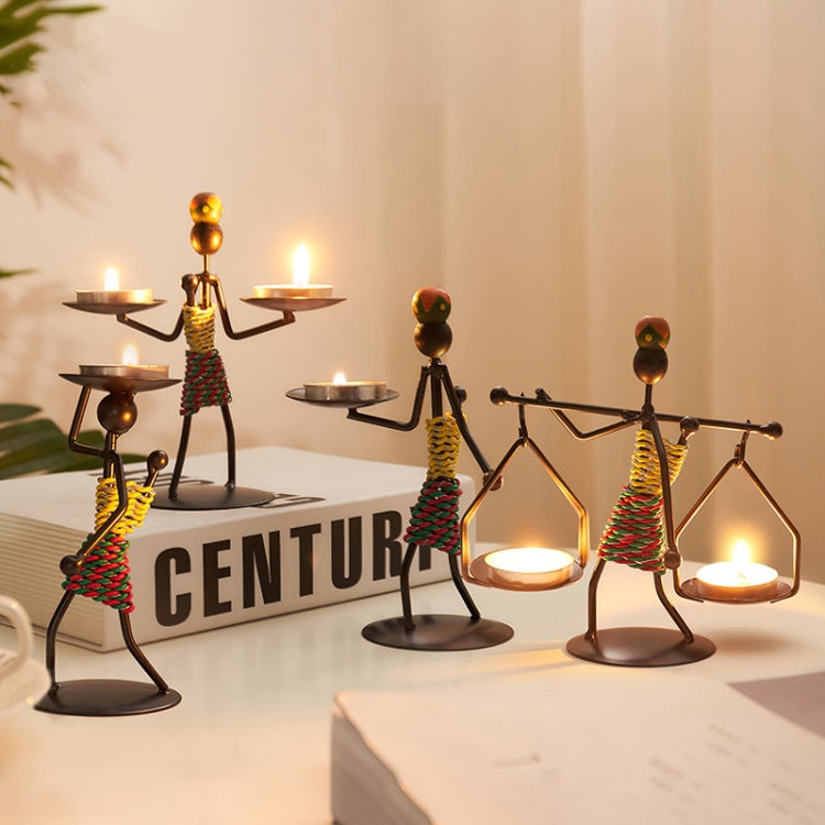 Retro Wrought Iron Man-shaped Candlestick Ornament, showcasing a unique design perfect for home and restaurant decor.