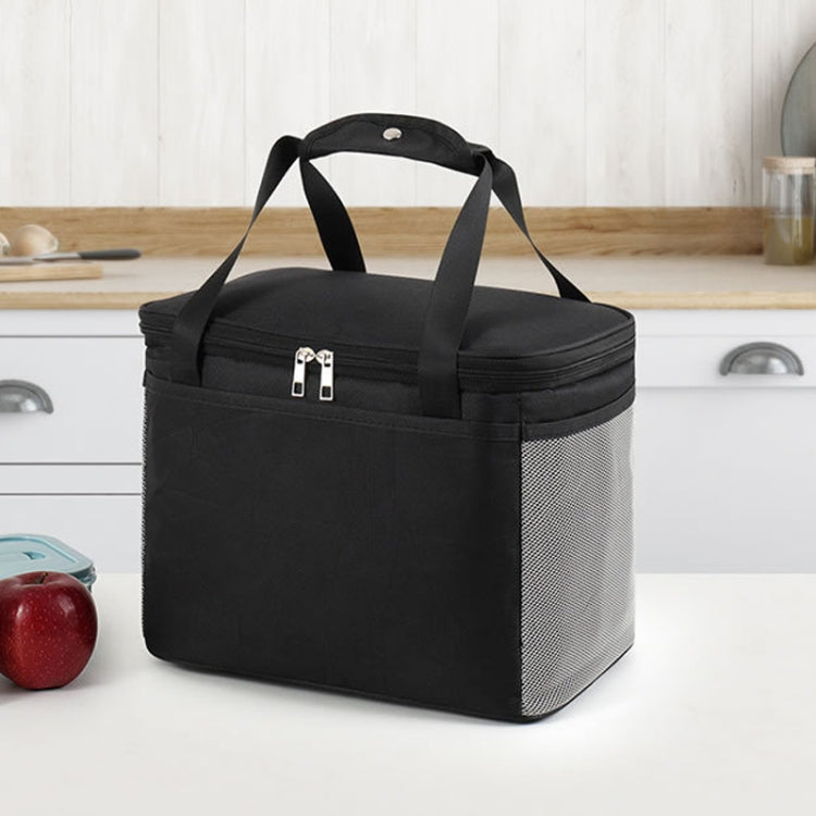 A stylish and functional reusable lunch bag featuring a waterproof Oxford cloth exterior, insulated aluminum lining, and comfortable hand strap, ideal for office, school, and outdoor use.