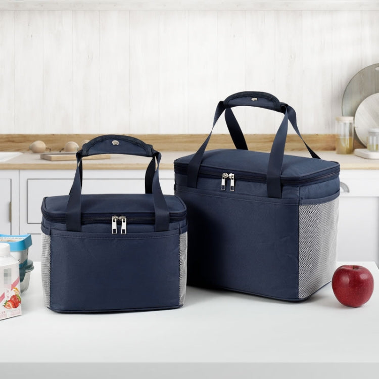 A stylish and functional reusable lunch bag featuring a waterproof Oxford cloth exterior, insulated aluminum lining, and comfortable hand strap, ideal for office, school, and outdoor use.