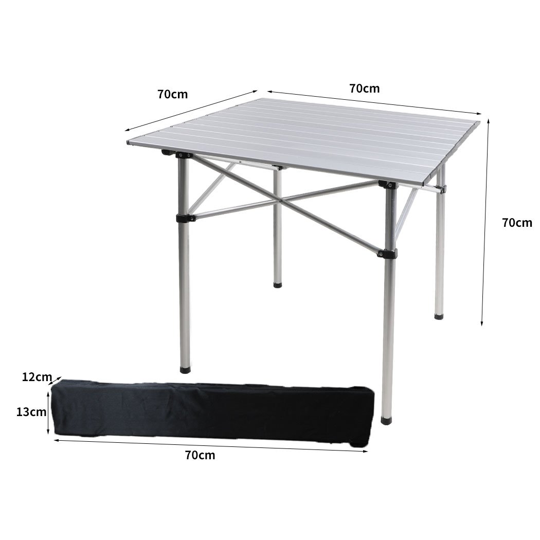 A lightweight and portable Roll Up Camping Table made of aluminium, set up outdoors with food and drinks on it, showcasing its sturdy design and anti-slip feet.