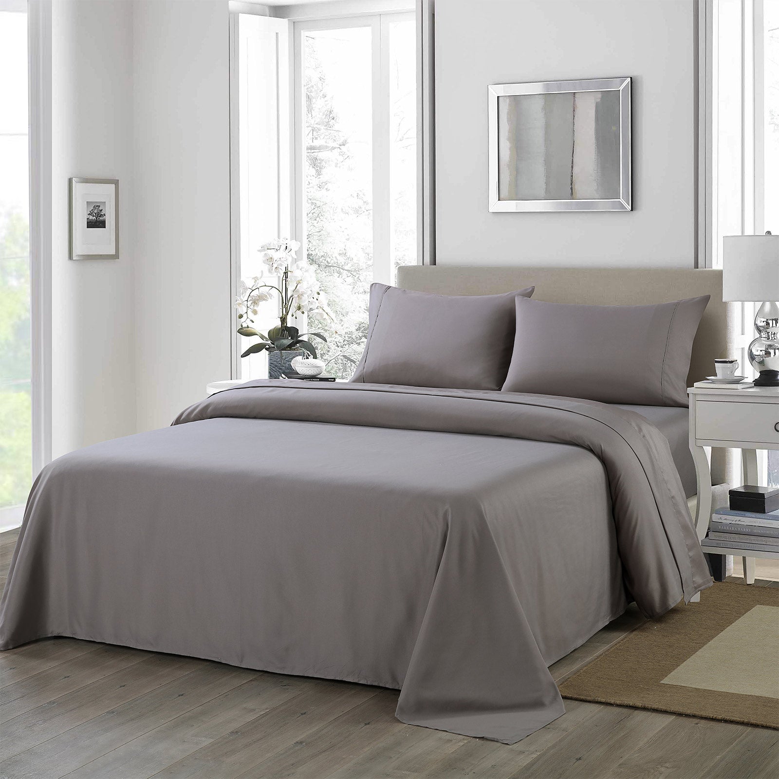 Royal Comfort 1200 Thread Count Sheet Set in elegant satin fabric, showcasing flat sheet, fitted sheet, and two pillowcases in various colors.
