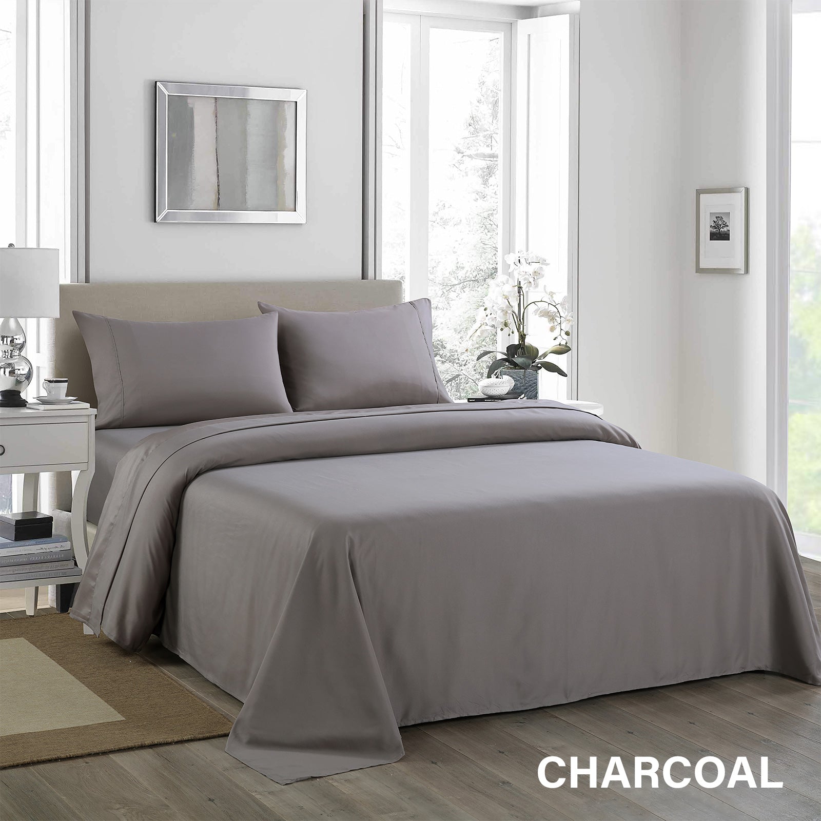 Royal Comfort 1200 Thread Count Sheet Set in elegant satin fabric, showcasing flat sheet, fitted sheet, and two pillowcases in various colors.