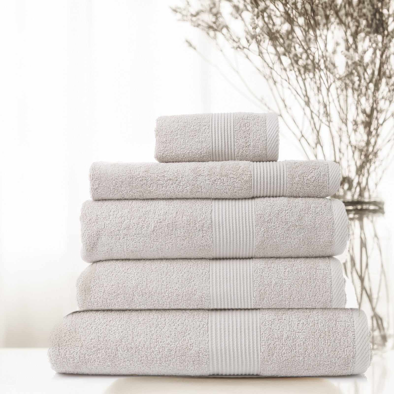Royal Comfort 5 Piece Cotton Bamboo Towel Set featuring plush bath towels, hand towel, wash towel, and bath mat in soft colors.