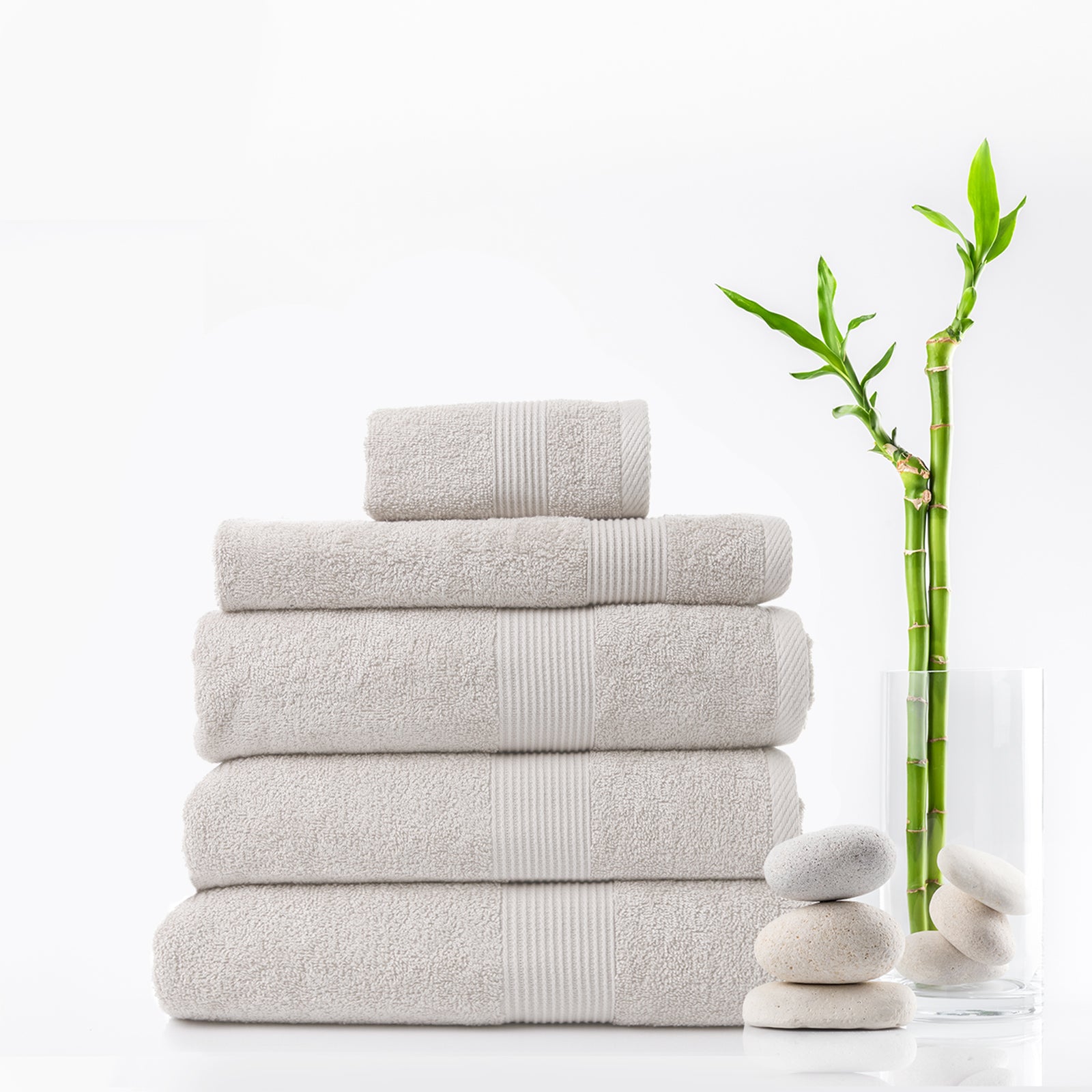 Royal Comfort 5 Piece Cotton Bamboo Towel Set featuring plush bath towels, hand towel, wash towel, and bath mat in soft colors.