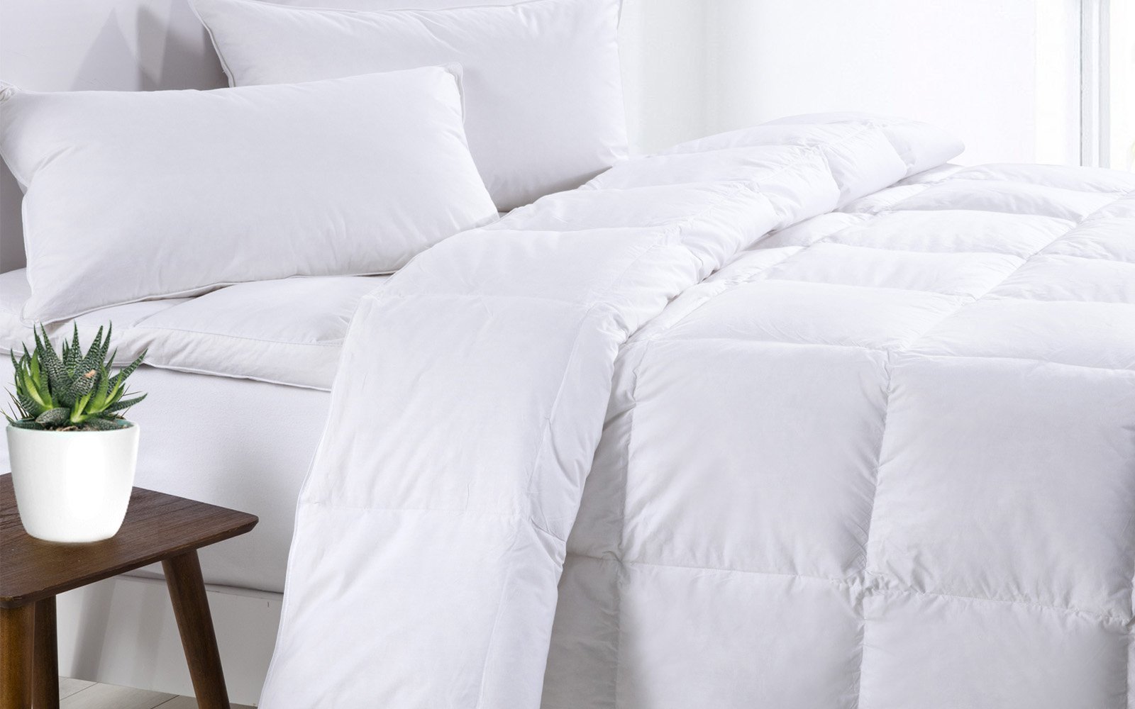 Royal Comfort 500GSM Goose Feather Down Quilt and Bamboo Quilted Pillow Set, showcasing luxurious materials and elegant design.
