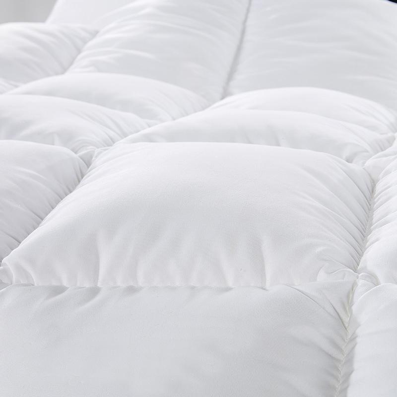 Royal Comfort Quilt featuring 50% duck down and 50% duck feather, encased in a soft 233TC cotton cover, showcasing its luxurious design and quality.