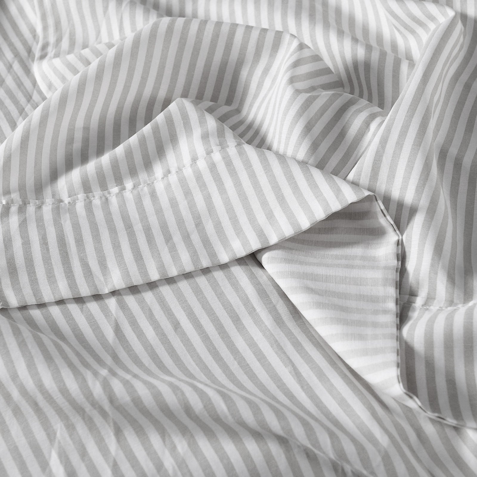 Royal Comfort Stripes Linen Blend Sheet Set featuring a neutral stripe design, showcasing its luxurious texture and breathable fabric.