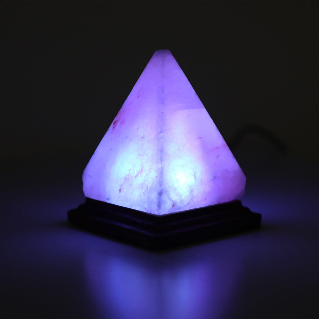 A USB Himalayan Salt Lamp Globe with a pyramid shape, emitting a warm orange glow, showcasing natural salt crystals.