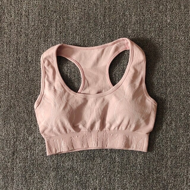 Seamless gym set featuring high waist leggings and sports bra in leopard pattern, available in black, pink, and blue.