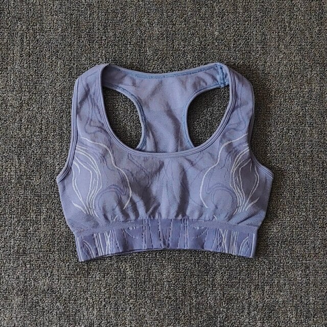 Seamless gym set featuring high waist leggings and sports bra in leopard pattern, available in black, pink, and blue.