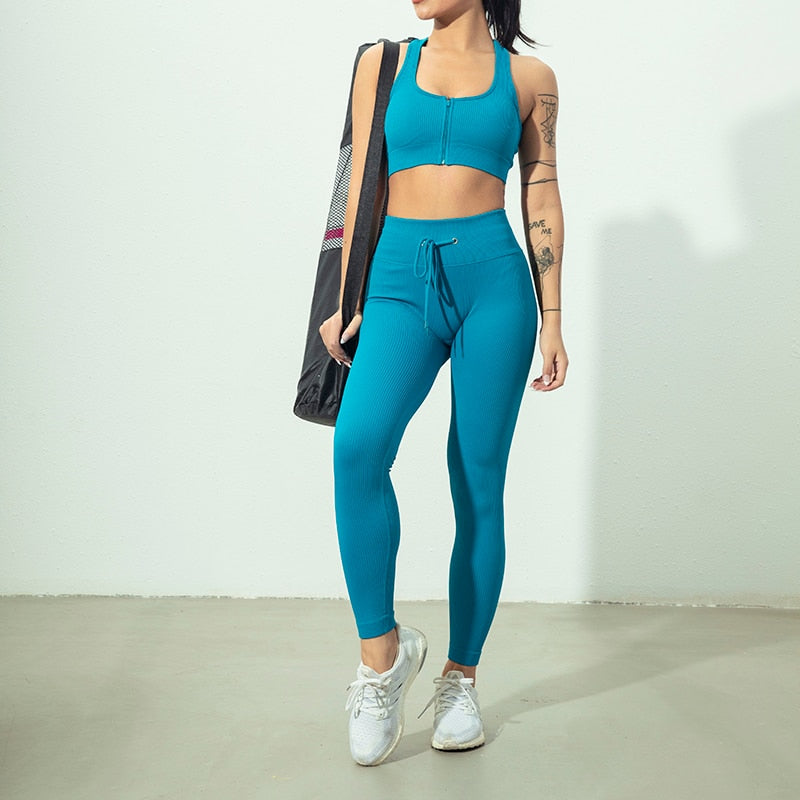 Seamless Yoga Set featuring a zipper long sleeve top and high waist leggings in various colors, perfect for women's workouts.