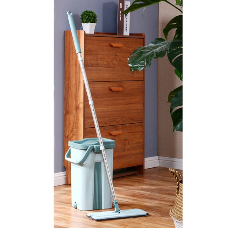 Self Cleaning Mop Bucket System featuring a flat squeeze mop, bucket, and microfiber pads for efficient floor cleaning.