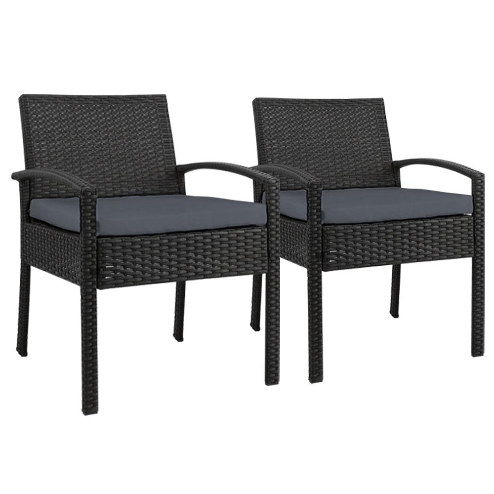 Set of 2 stylish outdoor dining chairs made of wicker with high-density foam cushions, perfect for patio or garden use.