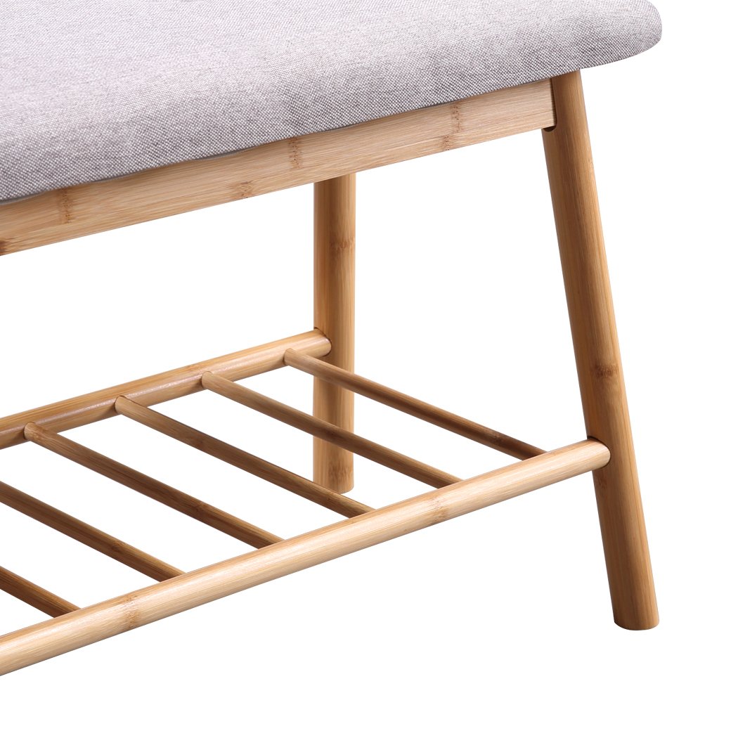 Bamboo shoe bench with cushion seat, stylish and compact design for entryway storage.