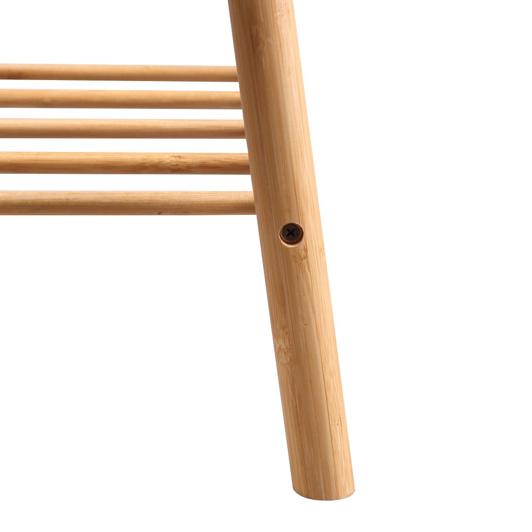 Bamboo shoe bench with cushion seat, stylish and compact design for entryway storage.