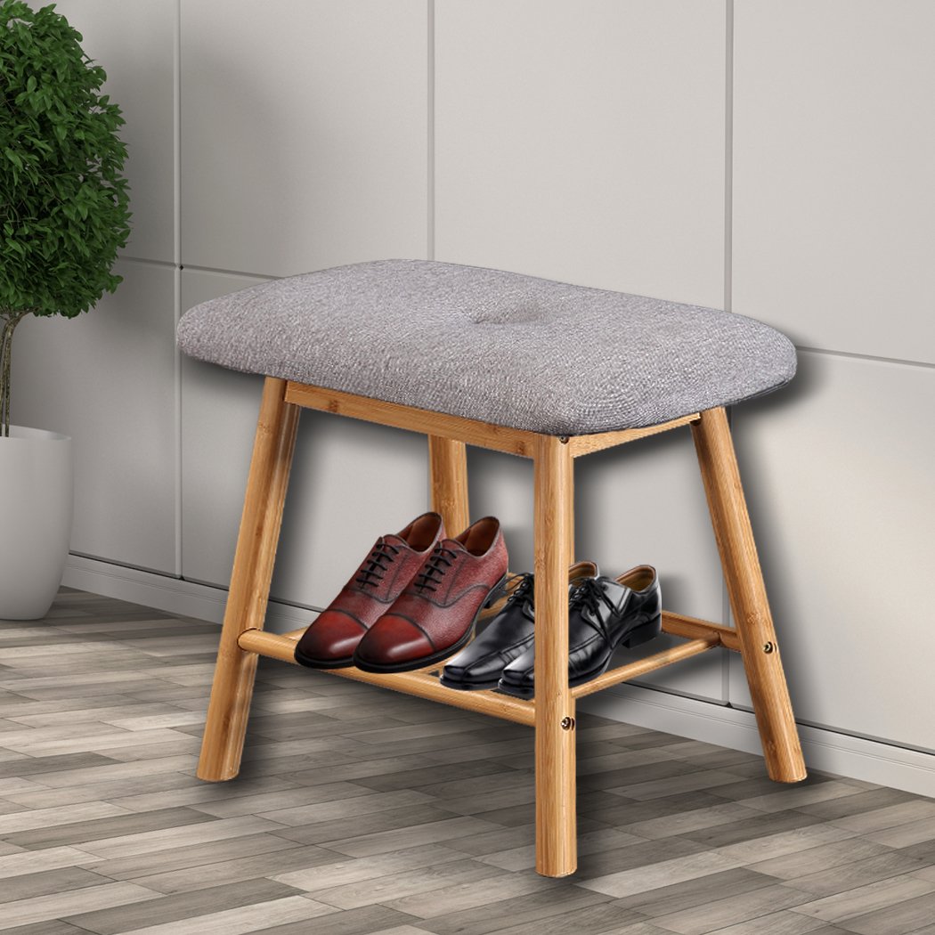 Bamboo shoe bench with cushion seat, stylish and compact design for entryway storage.