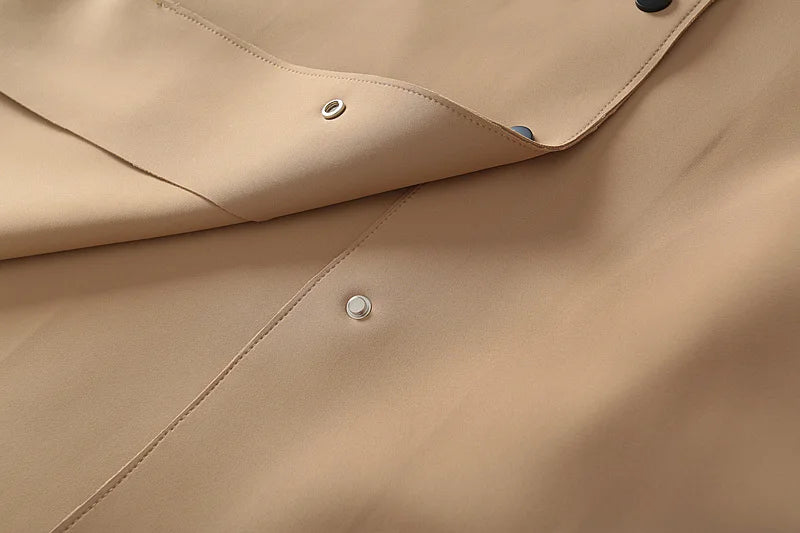 A stylish mid-length windbreaker in soft air cotton fabric, perfect for autumn fashion, featuring a trench coat design suitable for women.