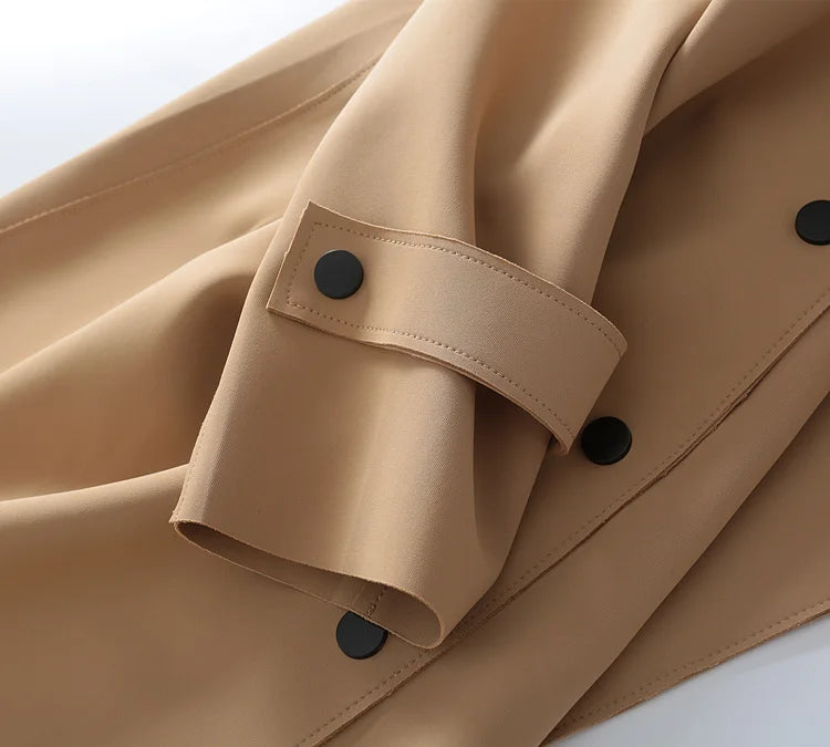 A stylish mid-length windbreaker in soft air cotton fabric, perfect for autumn fashion, featuring a trench coat design suitable for women.