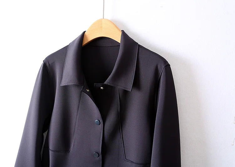 A stylish mid-length windbreaker in soft air cotton fabric, perfect for autumn fashion, featuring a trench coat design suitable for women.