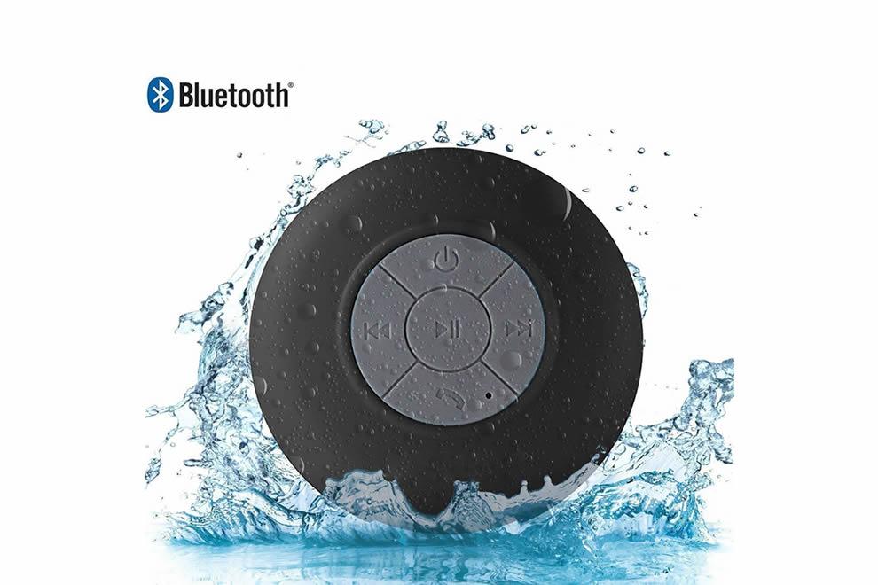 A vibrant Bluetooth speaker designed for use in the shower, featuring a waterproof silicone exterior and built-in microphone for hands-free calls.