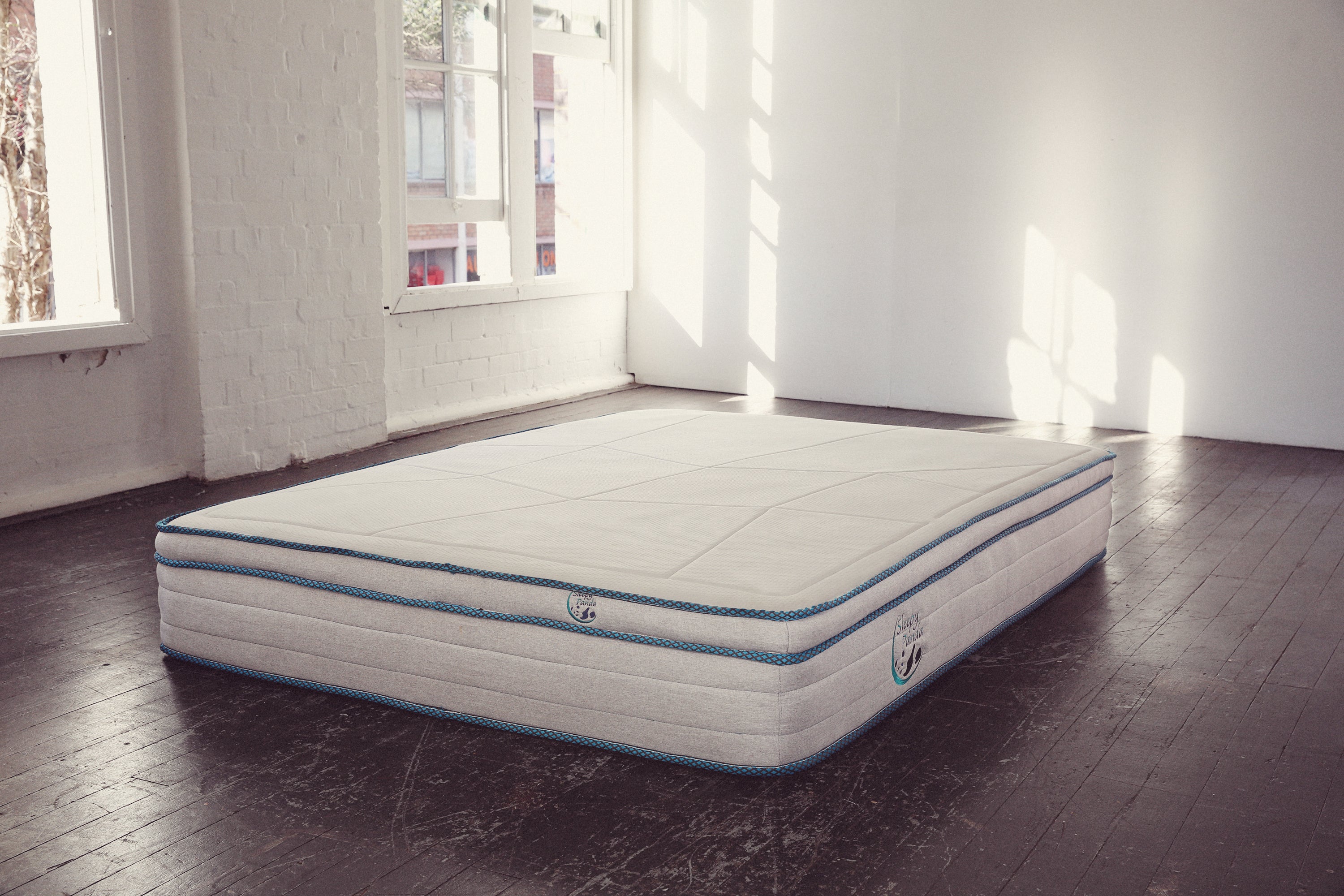 Sleepy Panda Mattress showcasing 5-zone pocket springs and natural latex layer, designed for medium-firm comfort.