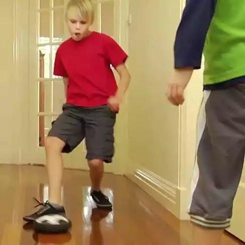 Slide And Glide Indoor Soccer Hover Ball with LED lights, floating above a smooth surface, showcasing its foam bumper.